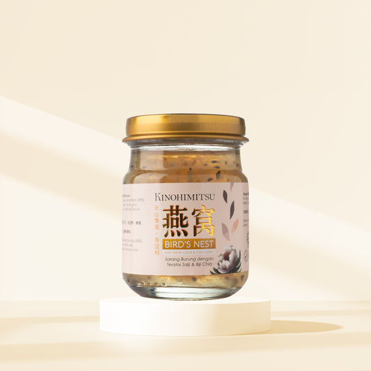 Kinohimitsu Bird's Nest with Snow Lotus & Chia Seeds in a jar for wellness on a light background. The label features product name and ingredients. Kinohimitsu Bird's Nest with Snow Lotus and Chia Seeds jar displayed on a pedestal. The label features both English and Asian characters, highlighting the product's wellness benefits.