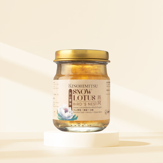 Kinohimitsu Snow Lotus Bird's Nest jar on a light background, featuring product label with ingredients and a gold lid.