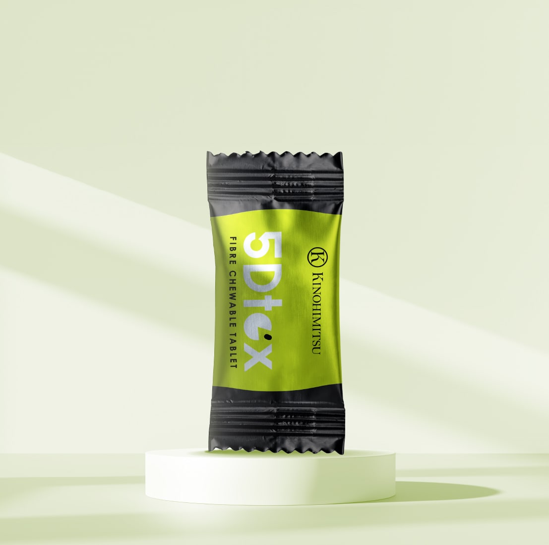 A package of Kinohimitsu 5Dtox fibre chewable tablets with green and black design, displayed on a light green background.