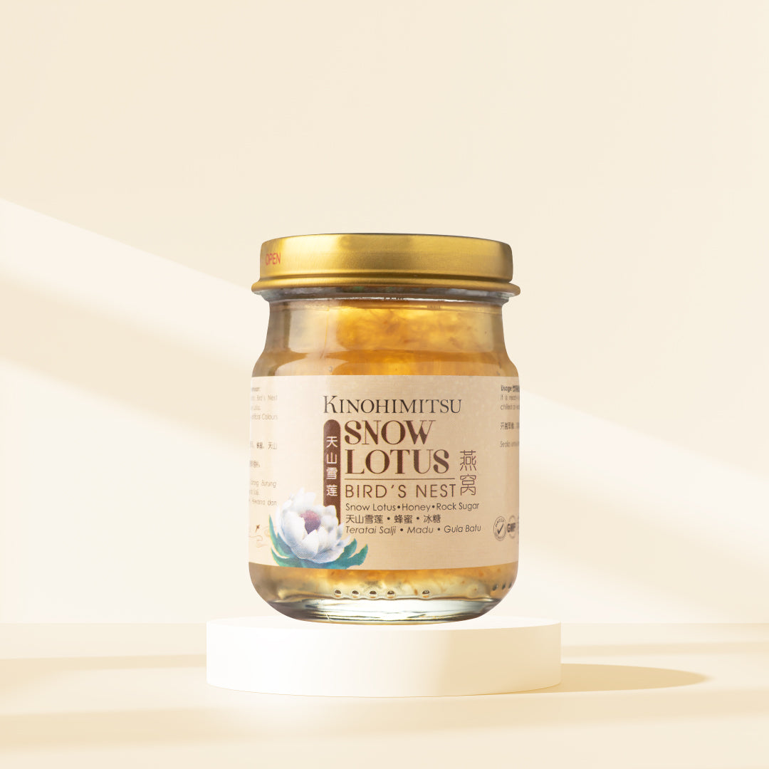 Kinohimitsu Snow Lotus Bird's Nest jar on a light background, featuring product label with ingredients and a gold lid.