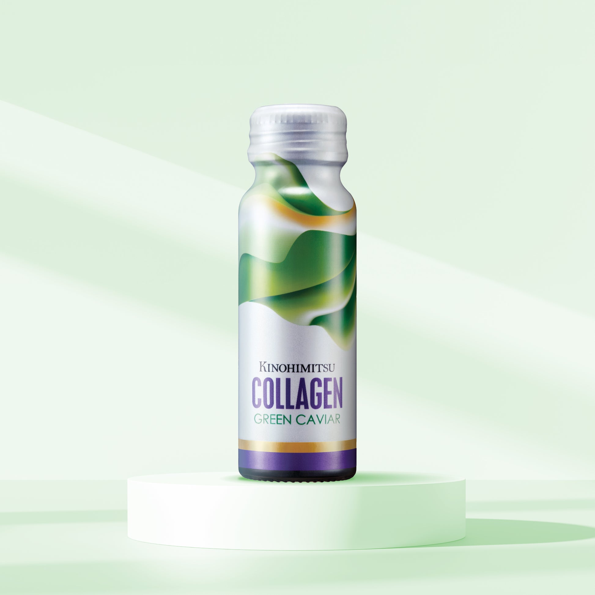 Bottle of Kinohimitsu Collagen Green Caviar displayed on a light green background, emphasizing the product's fresh and natural ingredients. Bottle of Kinohimitsu Collagen Green Caviar on a light green background, featuring a modern design with green and purple accents.