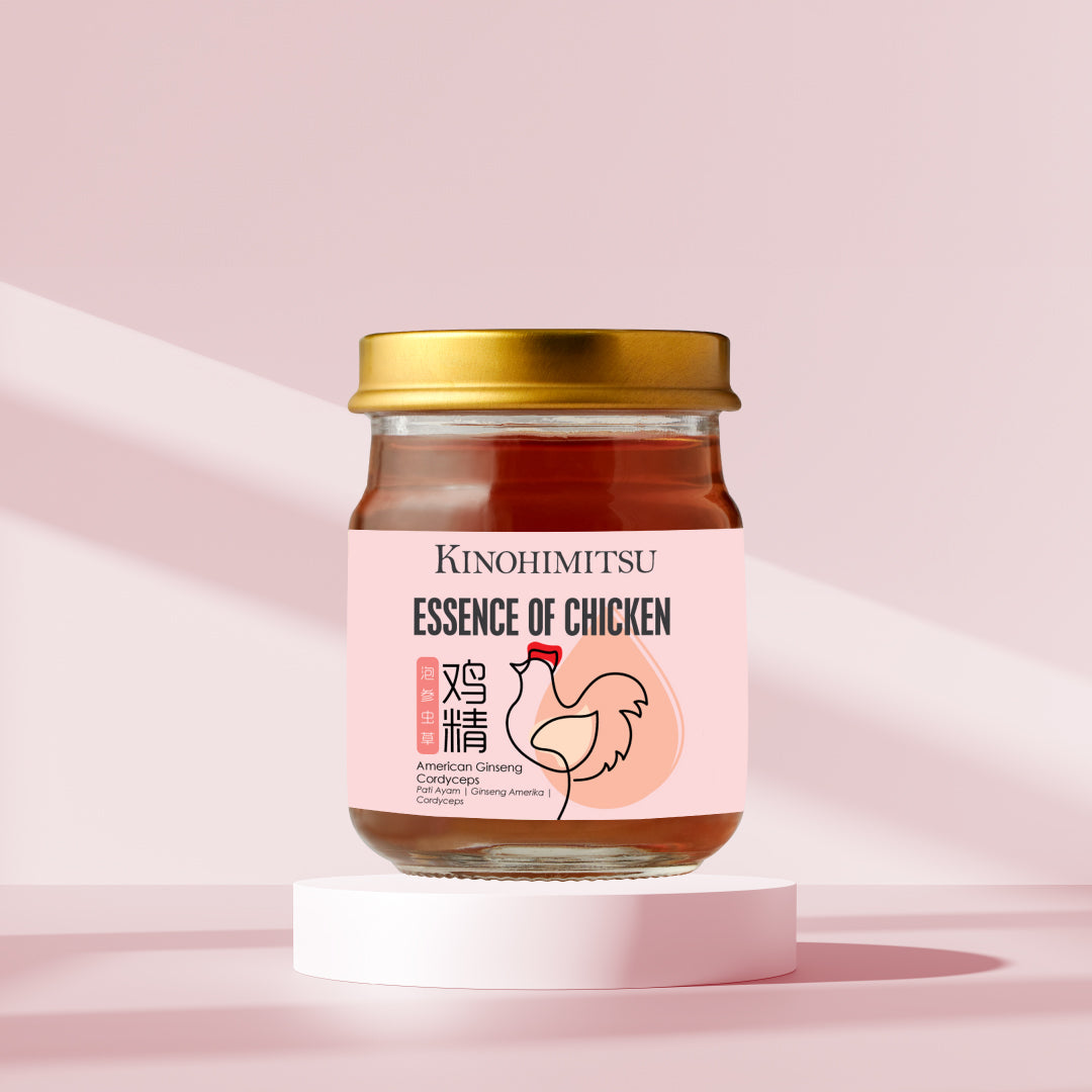 Premium Essence of Chicken with American Ginseng in a glass jar with a gold lid, placed on a white pedestal against a soft pink background. This health product aims to boost energy and immunity.
