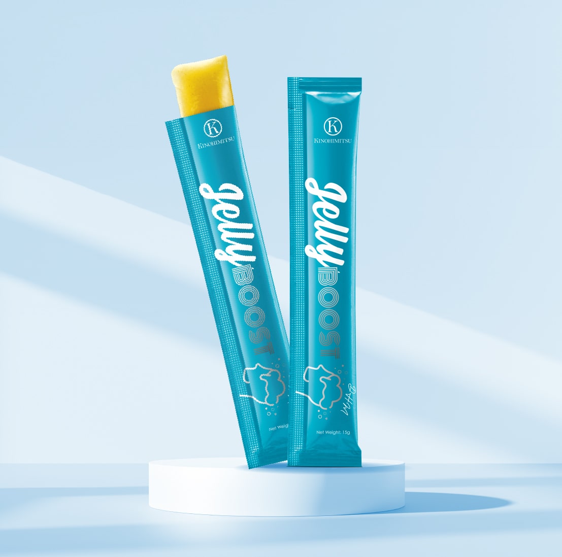 JellyBoost DHM by Kinohimitsu Malaysia, featuring two vibrant turquoise sachets of jelly displayed on a white pedestal with a light blue background.