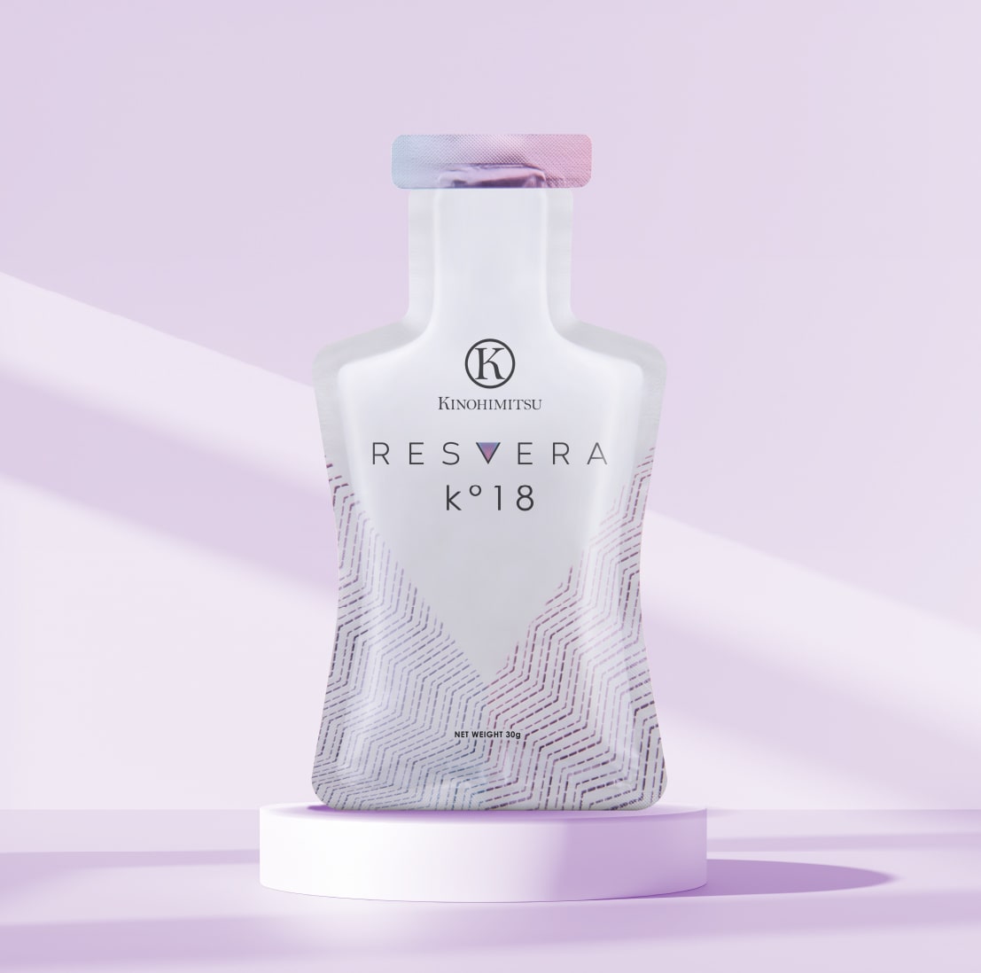 Bottle of Kinohimitsu Resvera K°18 on a pedestal against a pastel purple background, featuring a modern, minimalistic design. Resvera K°18 by Kinohimitsu Malaysia - A sleek, translucent bottle with pastel pink and purple hues, featuring the Kinohimitsu logo and Resvera K°18 branding, placed on a simple white cylindrical podium against a light purple background.