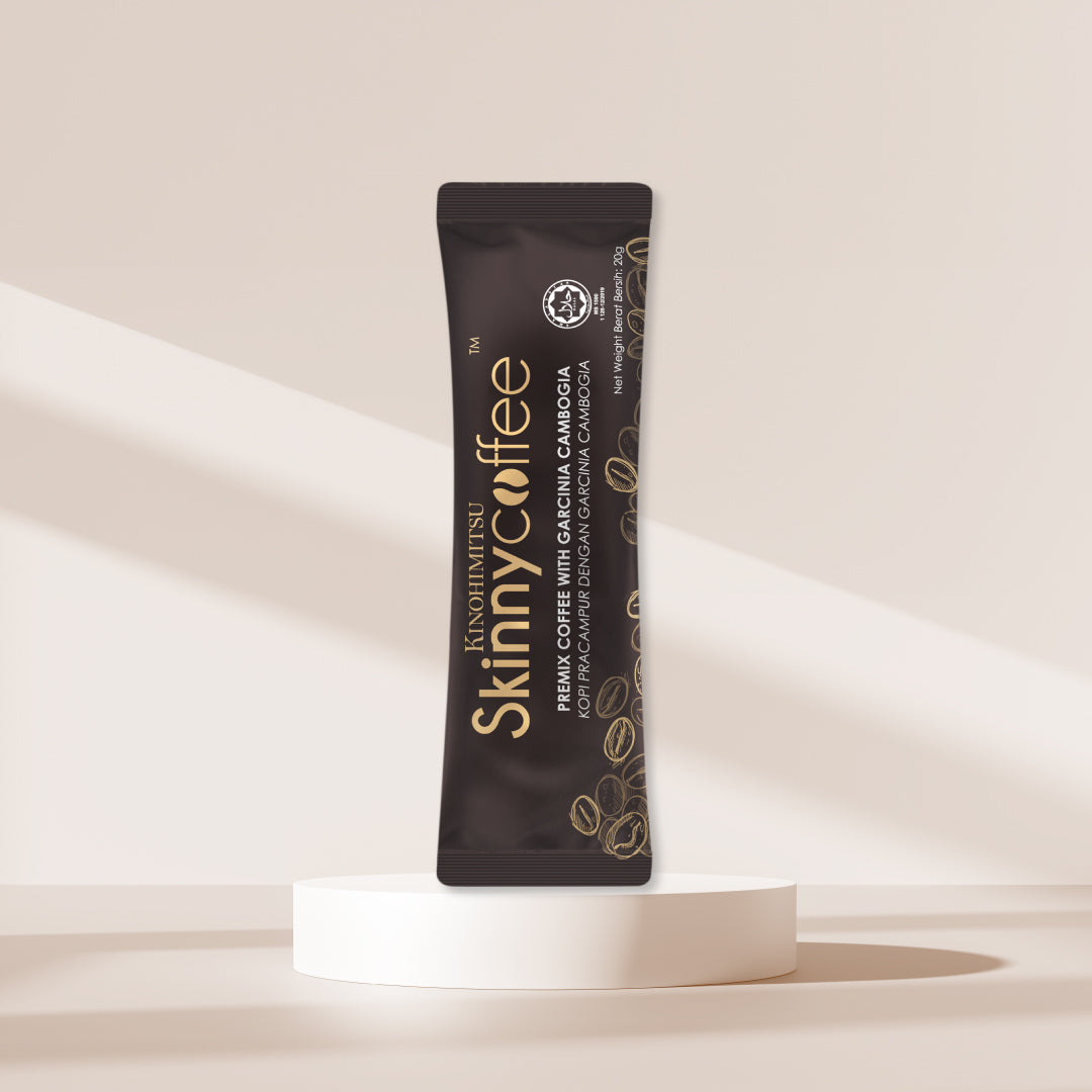 Kinohimitsu Skinny Coffee stick pack displayed on a minimalist white platform with a beige background, featuring the label 'Premix Coffee with Garcinia Cambogia.
